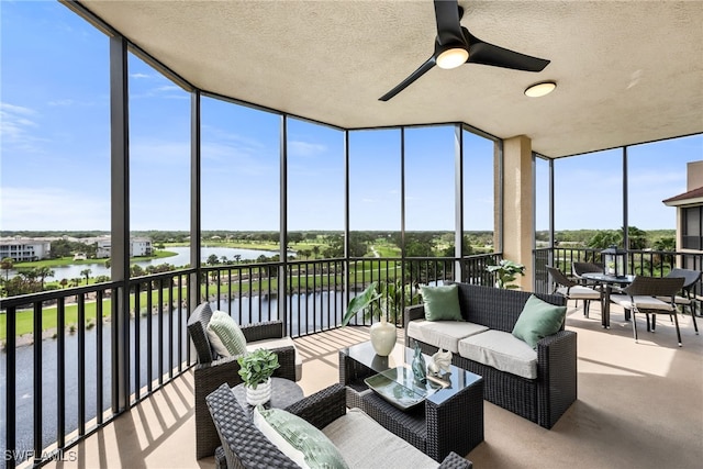 580 El Camino Real Unit 3606, Naples, FL 34119 - sunroom / solarium with a water view, ceiling fan, and an outdoor hangout area