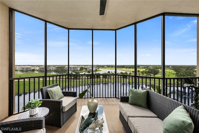 580 El Camino Real Unit 3606, Naples, FL 34119 - sunroom / solarium with a ceiling fan, a water view, and plenty of natural light