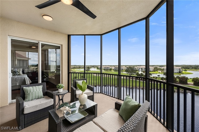 580 El Camino Real Unit 3606, Naples, FL 34119 - sunroom / solarium with ceiling fan, a water view, and healthy amount of natural light