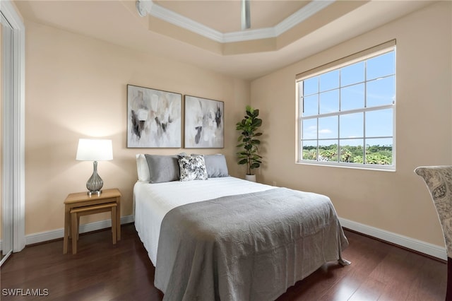 580 El Camino Real Unit 3606, Naples, FL 34119 - bedroom with ornamental molding, a raised ceiling, and hardwood / wood-style flooring