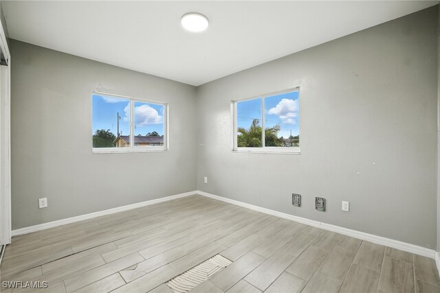 125/127 Gordon Ave S, Lehigh Acres, FL 33973 - unfurnished room with wood tiled floors