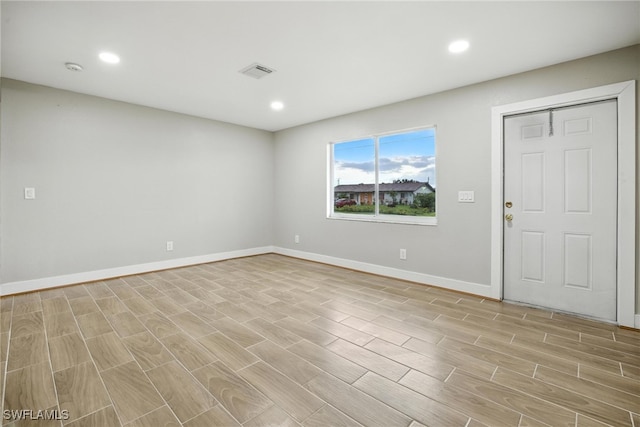 125/127 Gordon Ave S, Lehigh Acres, FL 33973 - spare room featuring recessed lighting and light wood-style floors