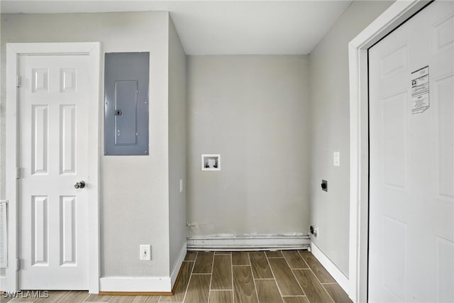 125/127 Gordon Ave S, Lehigh Acres, FL 33973 - laundry room featuring electric panel, electric dryer hookup, wood tiled floors, and washer hookup