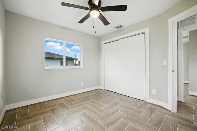 125/127 Gordon Ave S, Lehigh Acres, FL 33973 - unfurnished bedroom with a closet and a ceiling fan
