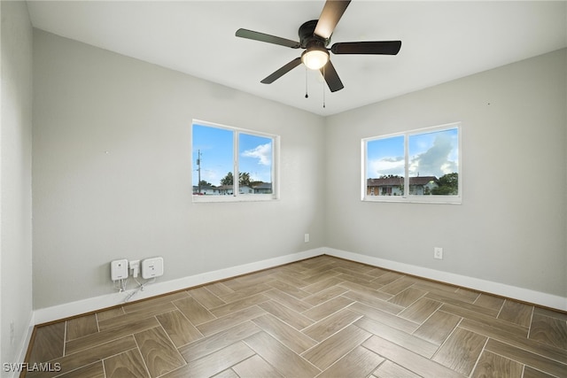 125/127 Gordon Ave S, Lehigh Acres, FL 33973 - spare room featuring plenty of natural light and a ceiling fan