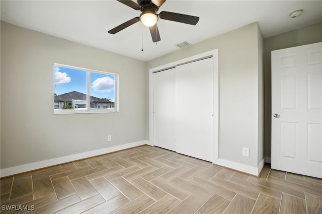 125/127 Gordon Ave S, Lehigh Acres, FL 33973 - unfurnished bedroom with a closet and ceiling fan