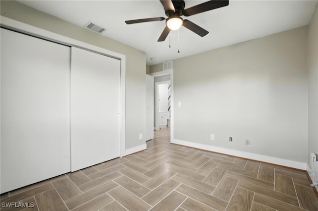 125/127 Gordon Ave S, Lehigh Acres, FL 33973 - unfurnished bedroom featuring a closet and a ceiling fan