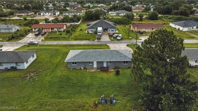 125/127 Gordon Ave S, Lehigh Acres, FL 33973 - aerial view of property and surrounding area with nearby suburban area