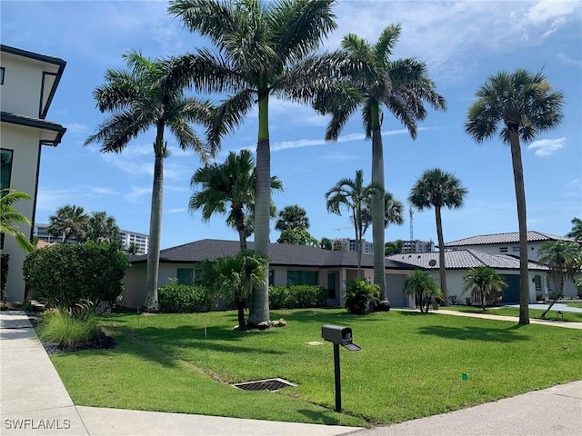 432 Oak Ave, Naples, FL 34108 - view of front of property with a front lawn