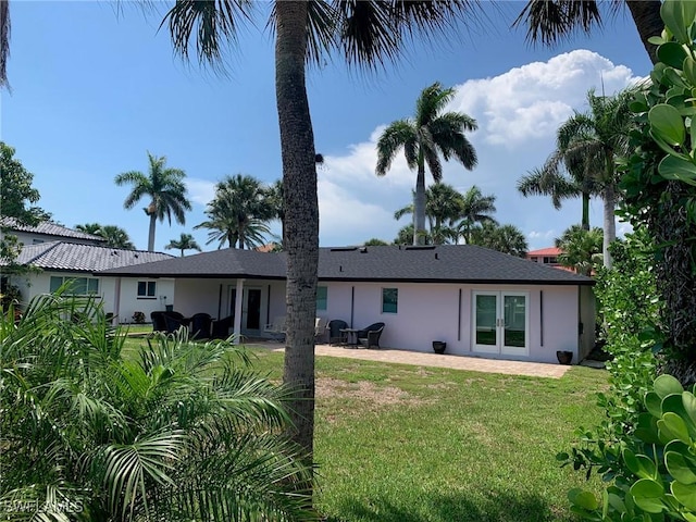 432 Oak Ave, Naples, FL 34108 - rear view of house with a patio, a lawn, french doors, and stucco siding