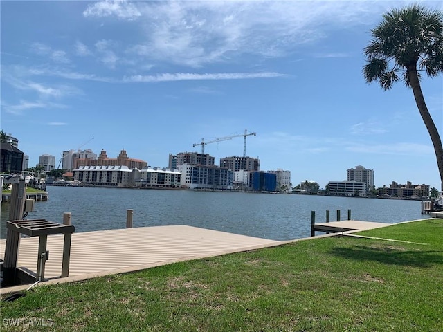 432 Oak Ave, Naples, FL 34108 - dock area with a lawn, a water view, and a city view