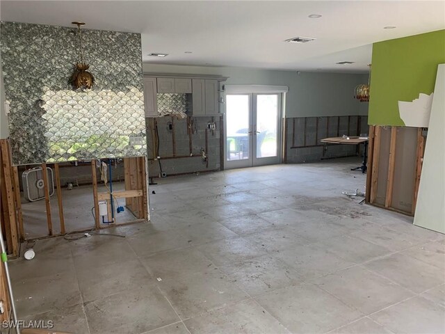 432 Oak Ave, Naples, FL 34108 - unfurnished living room with french doors
