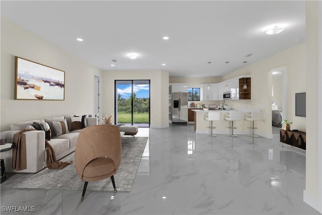 3307 18th St SW, Lehigh Acres, FL 33976 - living area with light marble finish flooring and recessed lighting
