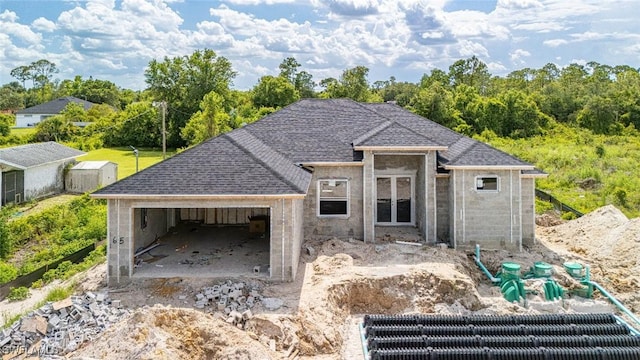 615 8th Ave, Lehigh Acres, FL 33972 - property under construction with an attached garage and a shingled roof