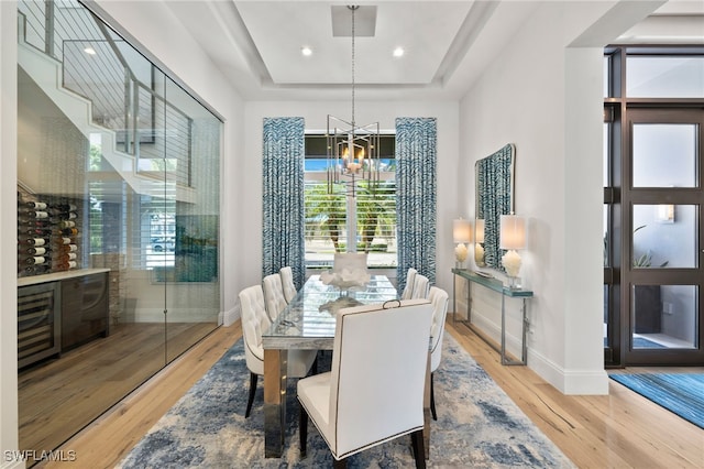 745 Riviera Dr, Naples, FL 34103 - dining room with a chandelier, wood finished floors, healthy amount of natural light, and recessed lighting