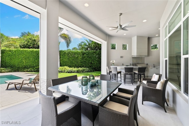 745 Riviera Dr, Naples, FL 34103 - view of patio featuring a ceiling fan, exterior kitchen, and outdoor dining area