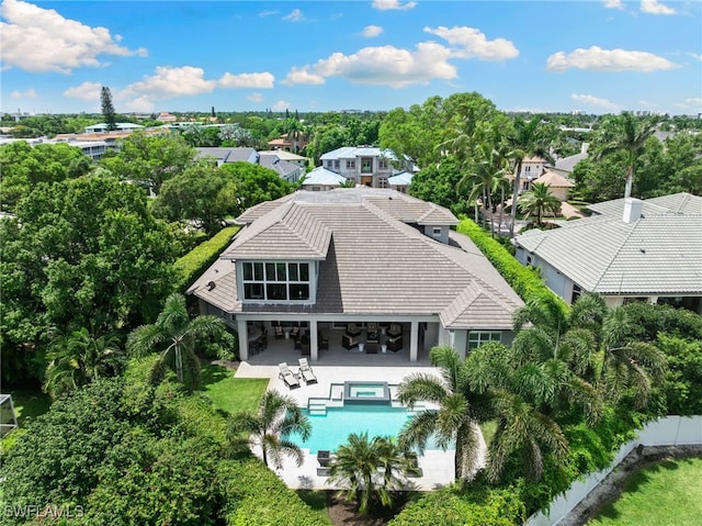 745 Riviera Dr, Naples, FL 34103 - view from above of property featuring a pool area and a tree filled landscape