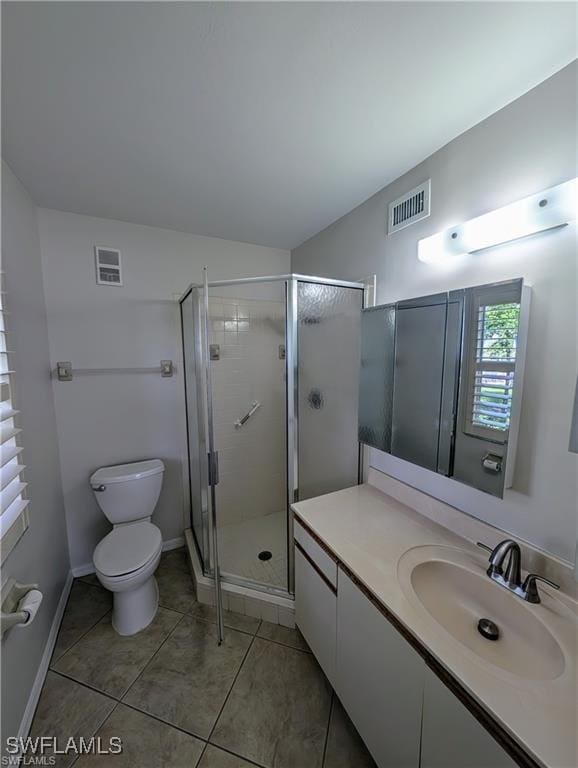 1915 Courtyard Way Unit G102, Naples, FL 34112 - full bathroom with vanity, a stall shower, and tile patterned flooring