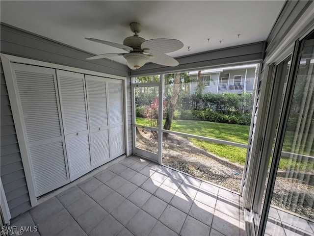 1915 Courtyard Way Unit G102, Naples, FL 34112 - unfurnished sunroom featuring a ceiling fan