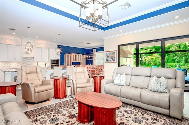 2110 Antigua Ln, Naples, FL 34120 - living room featuring a chandelier, ornamental molding, and recessed lighting