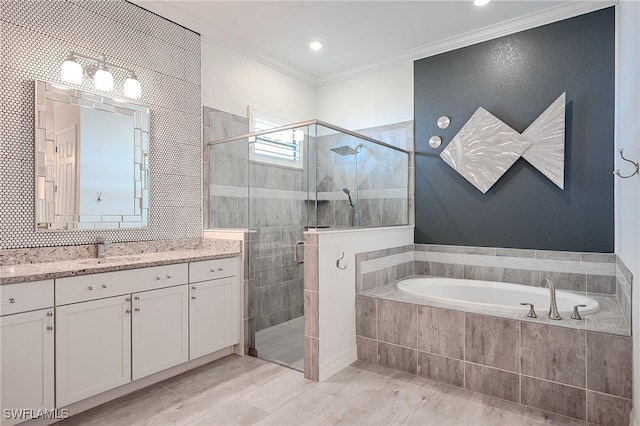 2110 Antigua Ln, Naples, FL 34120 - bathroom with a garden tub, a stall shower, vanity, ornamental molding, and recessed lighting