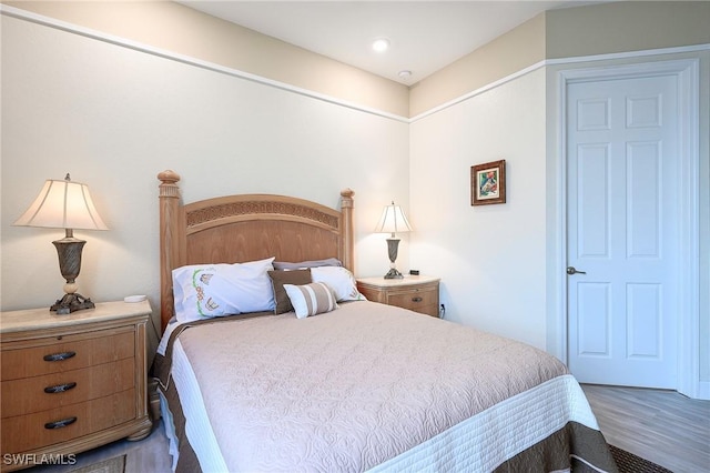 2110 Antigua Ln, Naples, FL 34120 - bedroom with wood finished floors