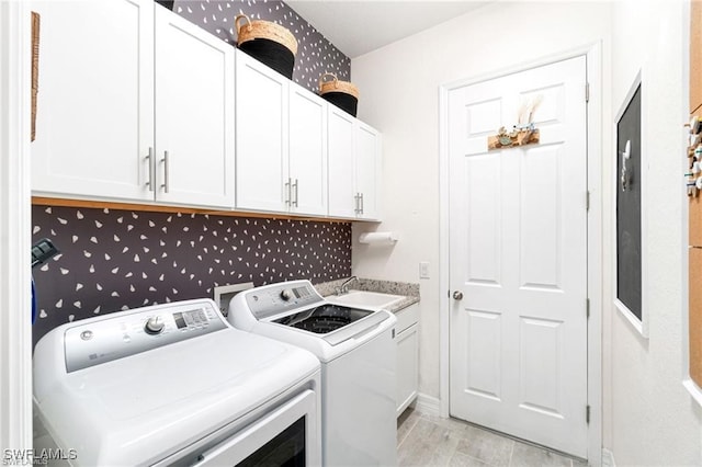 2110 Antigua Ln, Naples, FL 34120 - laundry area with independent washer and dryer and cabinet space