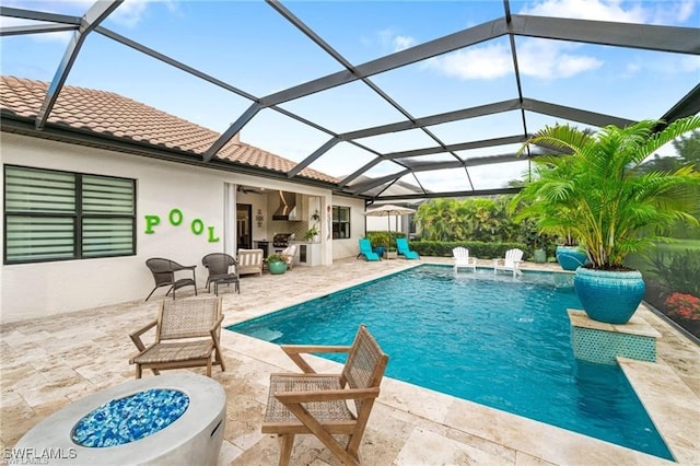 2110 Antigua Ln, Naples, FL 34120 - swimming pool with a patio, an outdoor fire pit, glass enclosure, and a ceiling fan