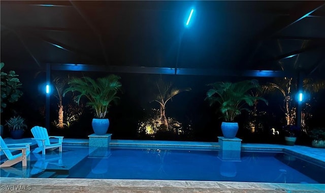 2110 Antigua Ln, Naples, FL 34120 - pool at night with an outdoor pool
