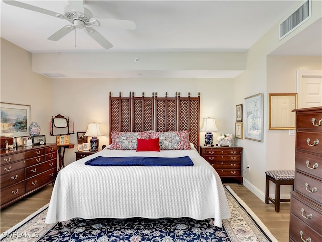 1001 Arbor Lake Dr Unit 1102, Naples, FL 34110 - bedroom with wood finished floors and a ceiling fan
