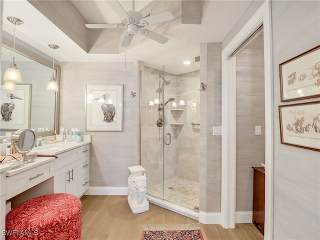1001 Arbor Lake Dr Unit 1102, Naples, FL 34110 - full bathroom featuring wood finished floors, vanity, ceiling fan, and a shower stall