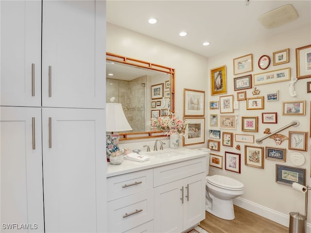 1001 Arbor Lake Dr Unit 1102, Naples, FL 34110 - full bath with vanity, wood finished floors, a shower, and recessed lighting