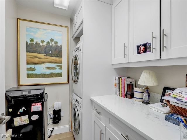 1001 Arbor Lake Dr Unit 1102, Naples, FL 34110 - washroom featuring stacked washer / dryer and cabinet space