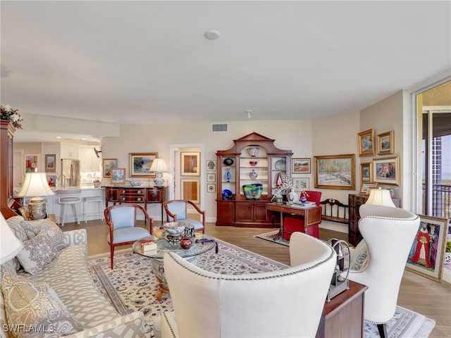 1001 Arbor Lake Dr Unit 1102, Naples, FL 34110 - living room featuring wood finished floors