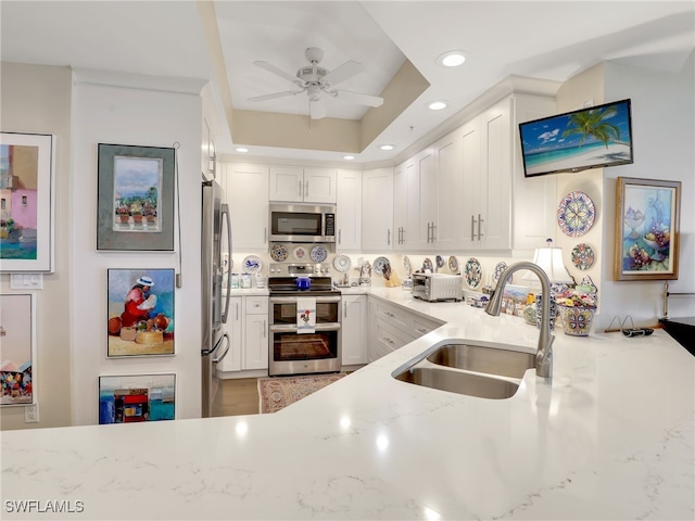 1001 Arbor Lake Dr Unit 1102, Naples, FL 34110 - kitchen with appliances with stainless steel finishes, white cabinetry, a ceiling fan, light stone counters, and recessed lighting