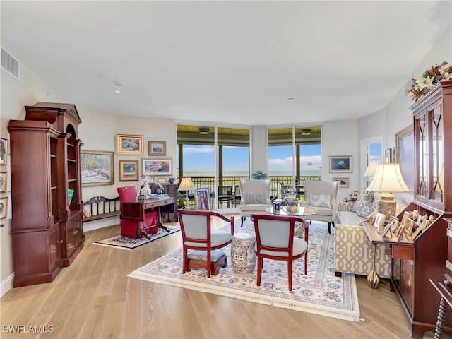 1001 Arbor Lake Dr Unit 1102, Naples, FL 34110 - living area with light wood-type flooring
