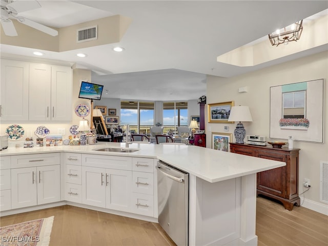 1001 Arbor Lake Dr Unit 1102, Naples, FL 34110 - kitchen with stainless steel dishwasher, a peninsula, light wood finished floors, recessed lighting, and light countertops