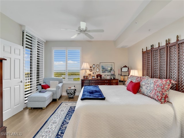 1001 Arbor Lake Dr Unit 1102, Naples, FL 34110 - bedroom featuring wood finished floors and a ceiling fan