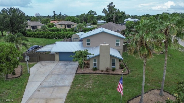 195 E Mariana Ave, North Fort Myers, FL 33917 - view of front of house featuring concrete driveway and a garage