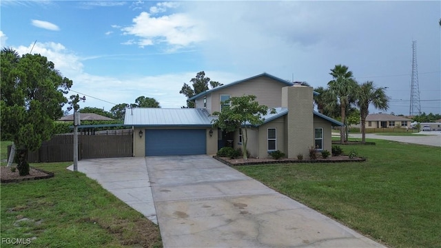 195 E Mariana Ave, North Fort Myers, FL 33917 - view of front of property featuring a chimney, concrete driveway, and an attached garage