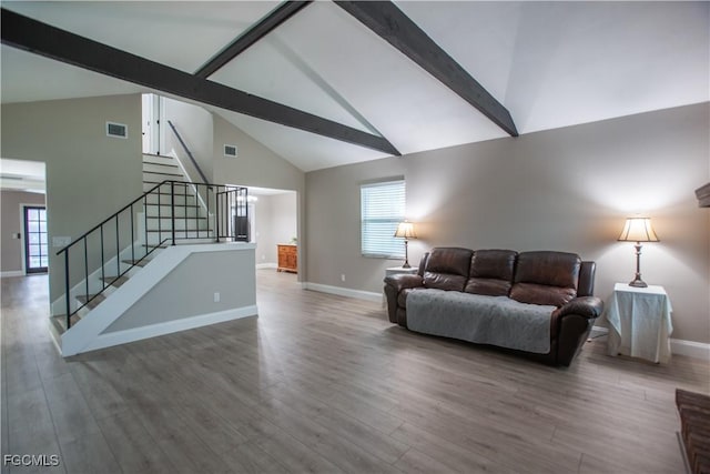 195 E Mariana Ave, North Fort Myers, FL 33917 - living area featuring beamed ceiling, high vaulted ceiling, stairs, plenty of natural light, and wood finished floors