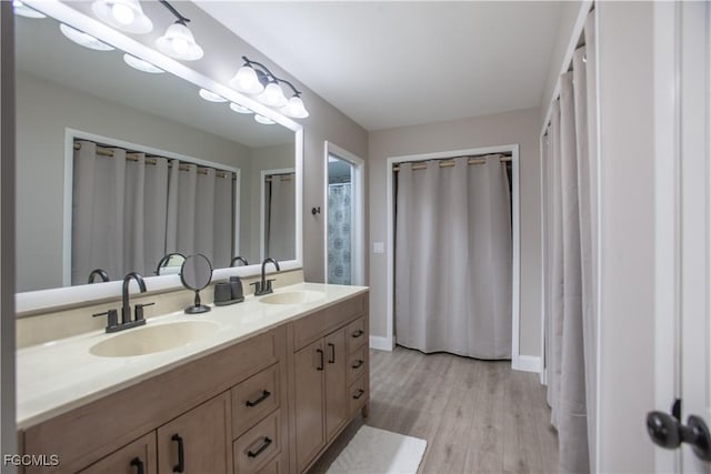 195 E Mariana Ave, North Fort Myers, FL 33917 - full bathroom featuring double vanity and wood finished floors