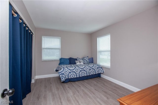 195 E Mariana Ave, North Fort Myers, FL 33917 - bedroom featuring light wood-type flooring and baseboards