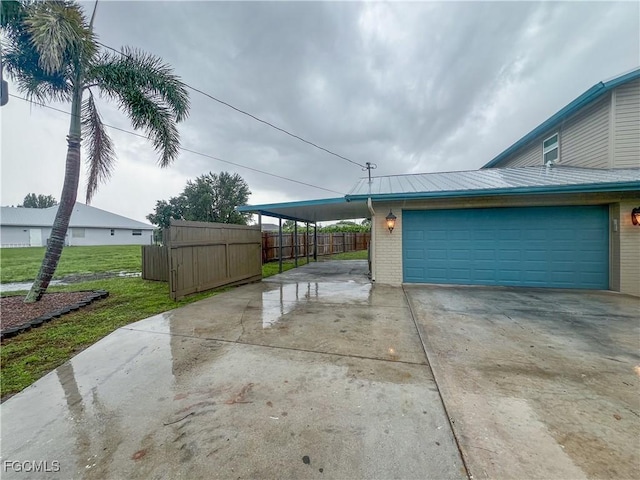 195 E Mariana Ave, North Fort Myers, FL 33917 - garage featuring driveway and a carport