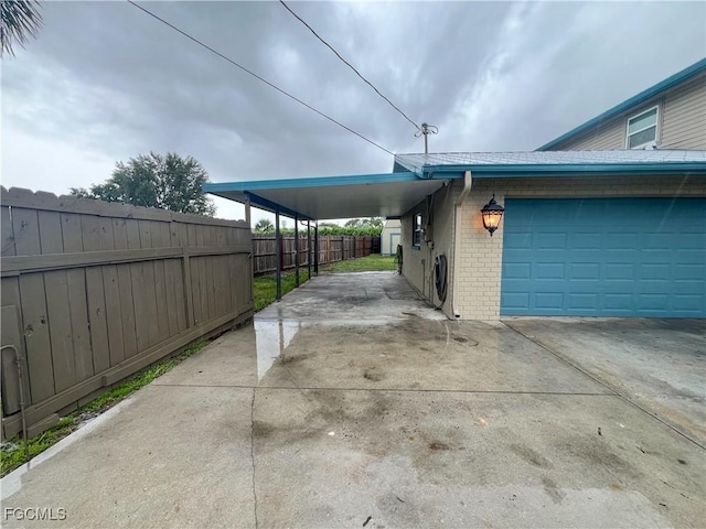 195 E Mariana Ave, North Fort Myers, FL 33917 - view of side of property with brick siding, driveway, and a carport