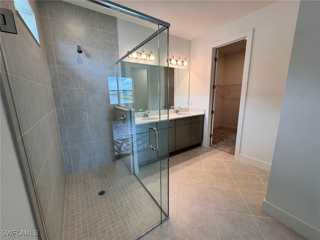 16381 Preservation Blvd, Punta Gorda, FL 33982 - full bath featuring tiled shower, double vanity, tile patterned floors, and a spacious closet