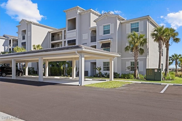 43993 Boardwalk Loop Unit 1918, Punta Gorda, FL 33982 - view of property with covered and uncovered parking