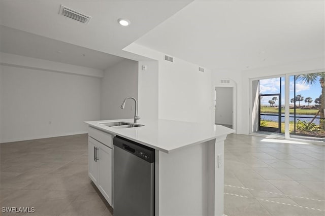 43993 Boardwalk Loop Unit 1918, Punta Gorda, FL 33982 - kitchen featuring stainless steel dishwasher, open floor plan, a kitchen island with sink, light tile patterned floors, and light countertops