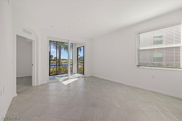 43993 Boardwalk Loop Unit 1918, Punta Gorda, FL 33982 - spare room with light tile patterned floors and a water view