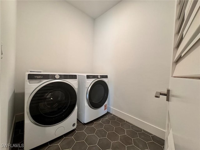 16106 Preservation Blvd, Punta Gorda, FL 33982 - laundry room featuring separate washer and dryer and dark tile patterned flooring